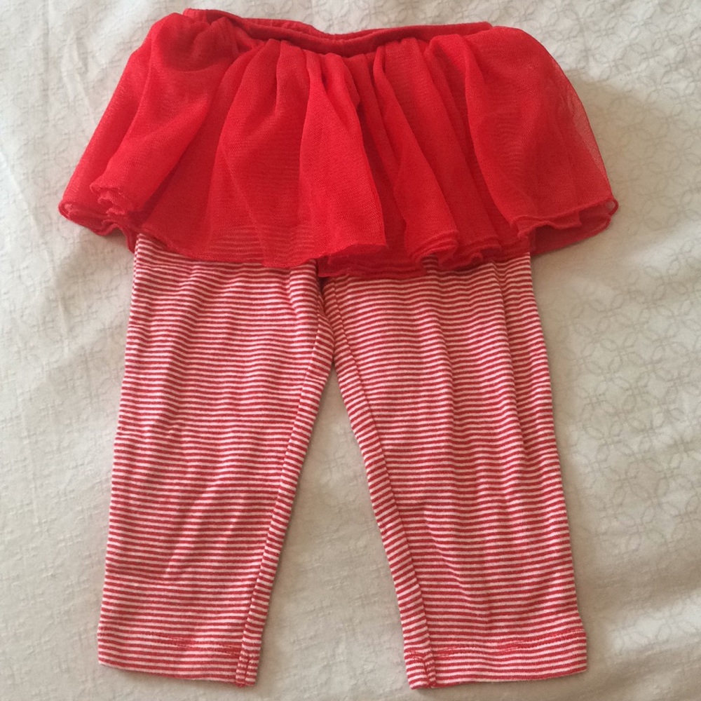 Red striped leggings with attached tulle skirt.